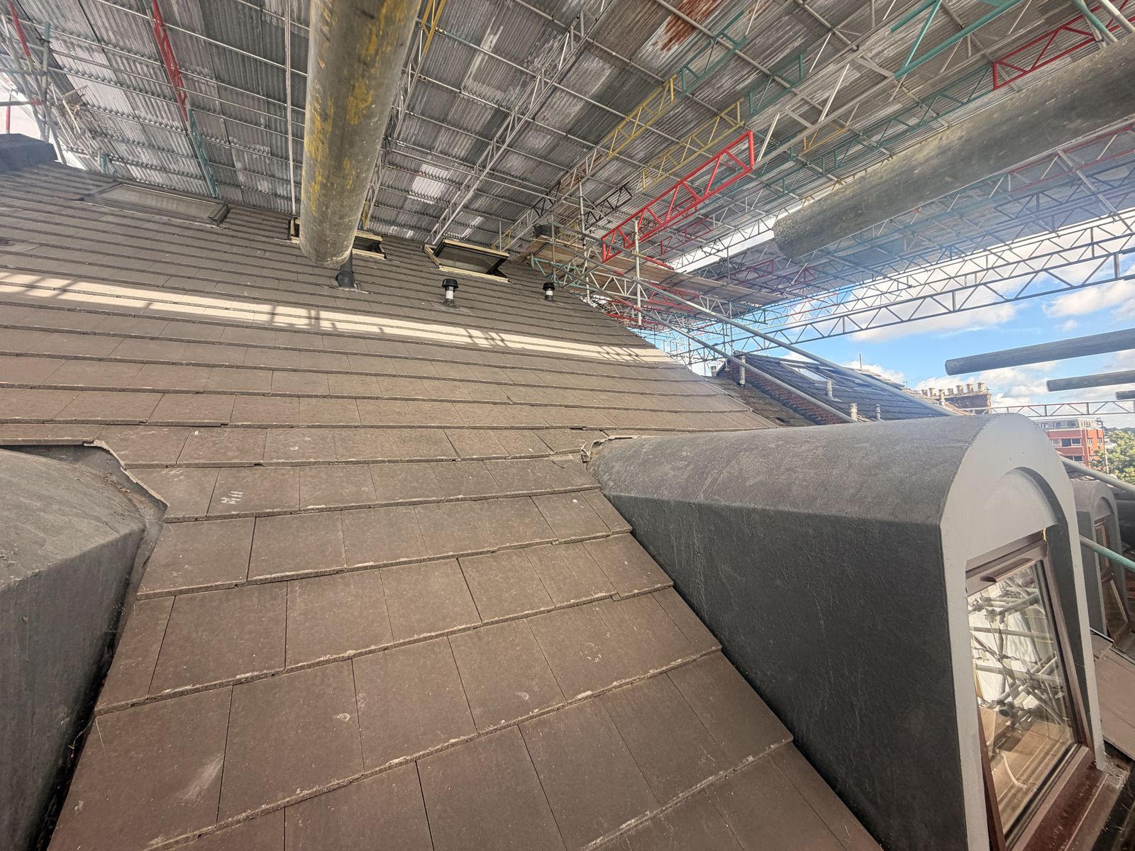 Pitched roof slope with vent terminals recorded before works