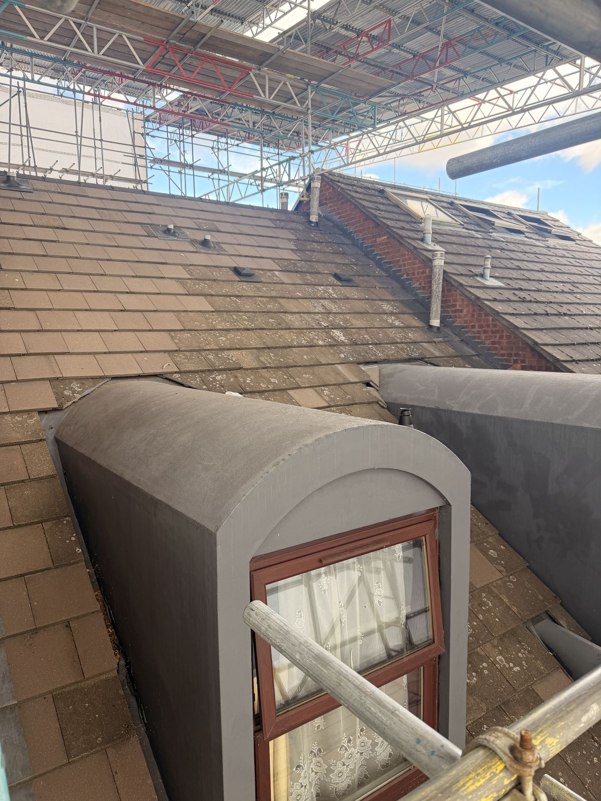 Run of dormers along the roof slope