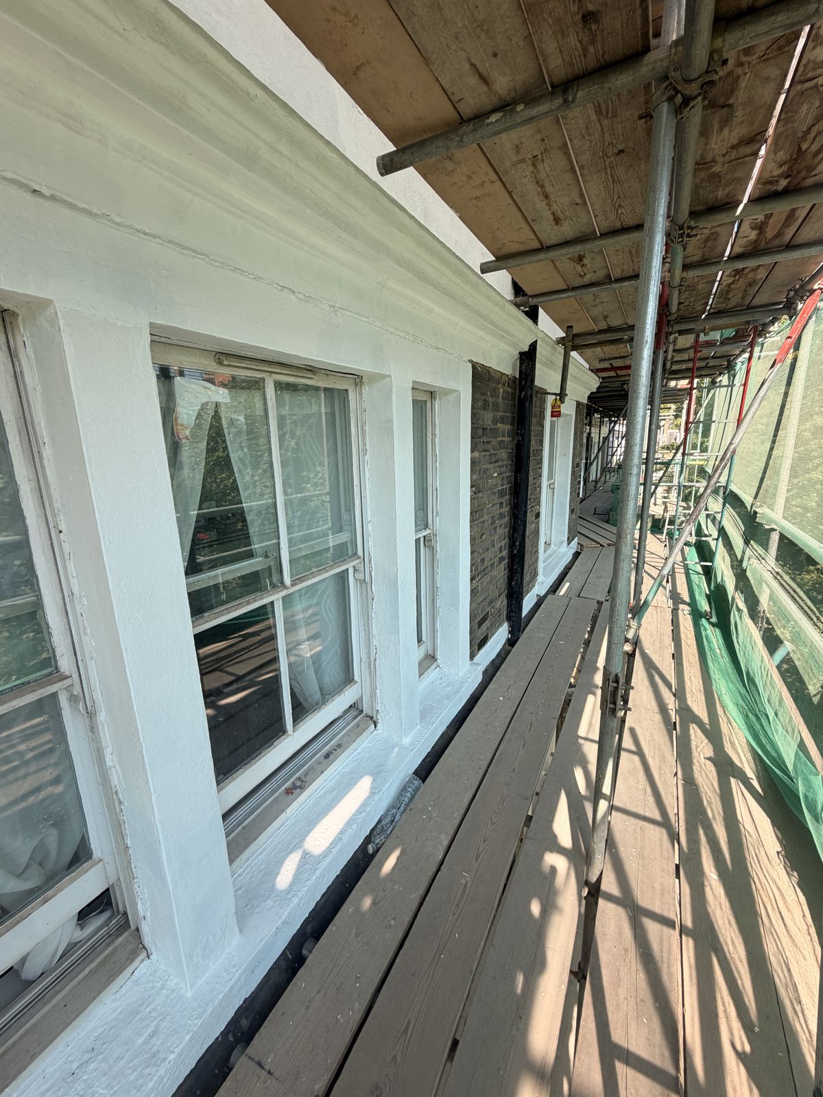 Cornice and dentil course after repair and before decoration