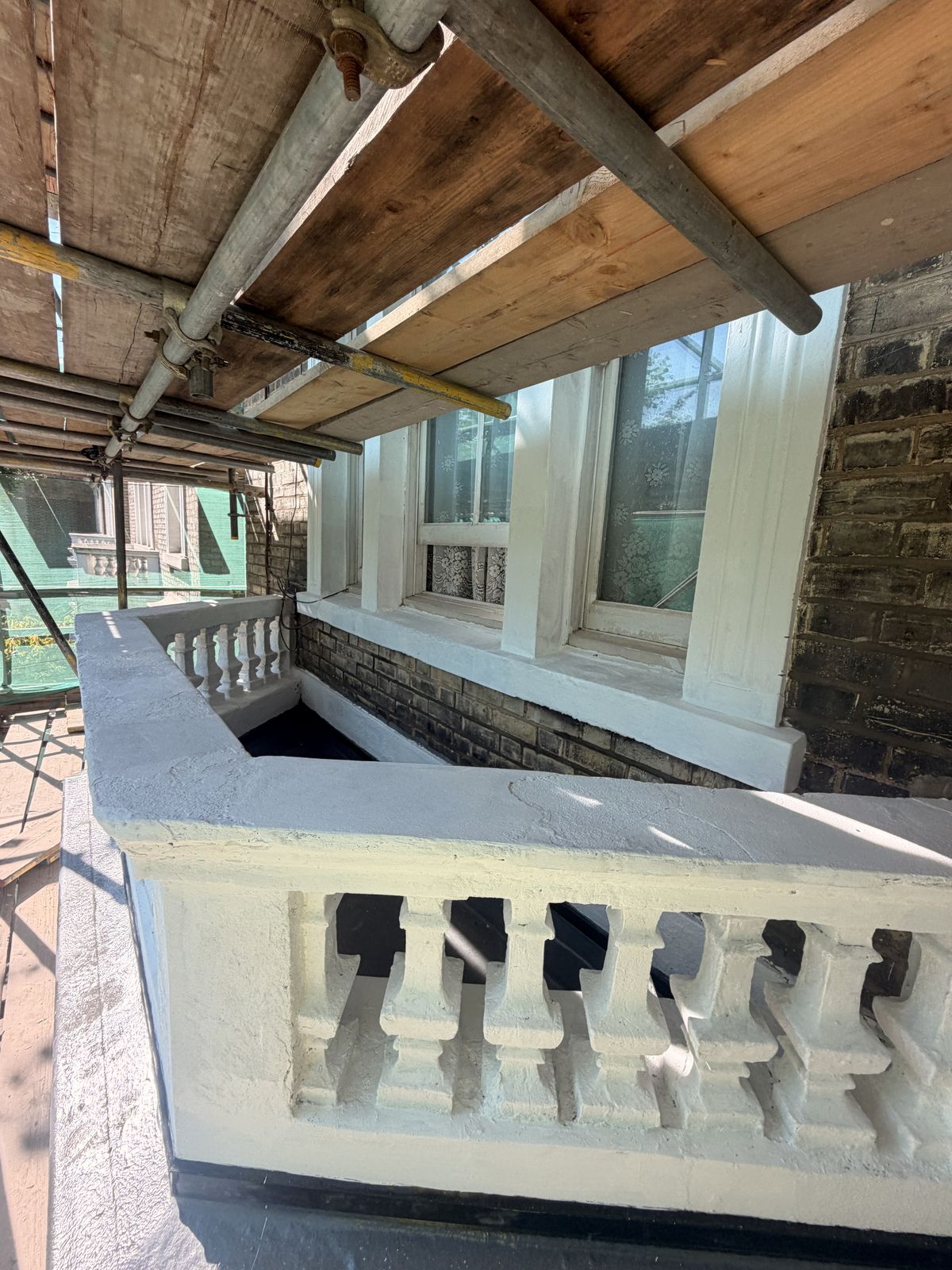 Section of front elevation after repair and redecoration